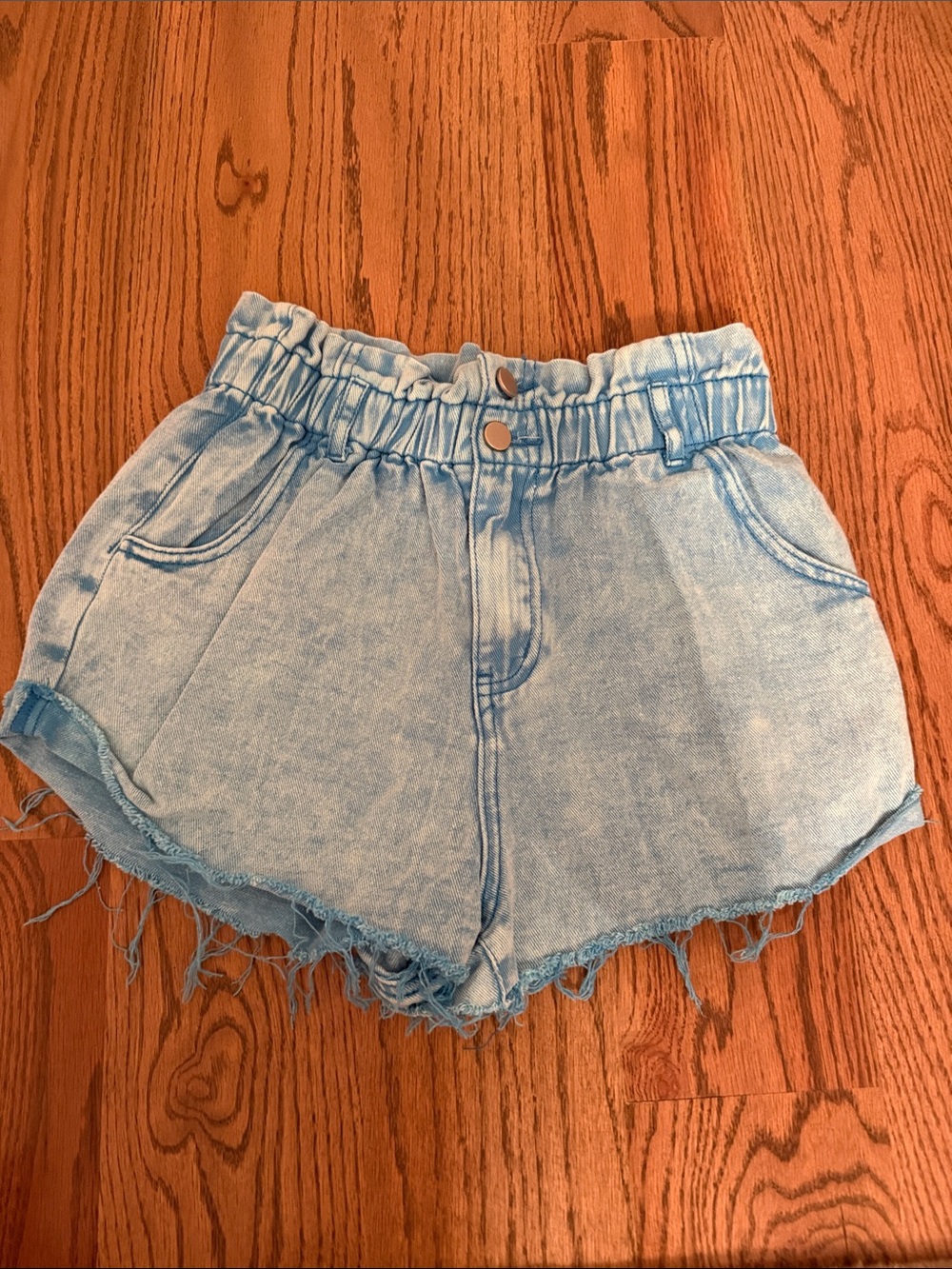High-Waist Light Blue Denim Paperbag Shorts with Frayed Hem